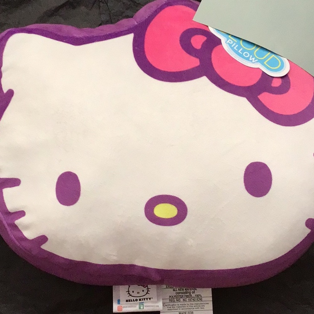 Hello Kitty purple Cloud travel pillow. Approximately 17 inches wide.